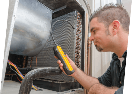 A technician from Paragon Service Pros measures the temperature of a water heater with a specialized tool.