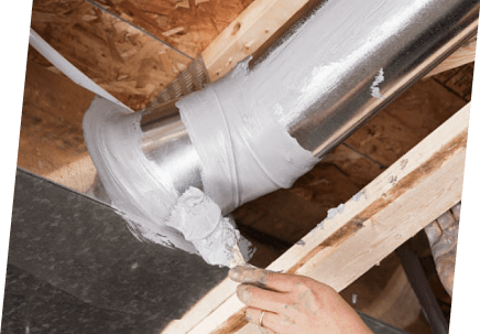 A technician from Paragon Service Pros uses a metal pipe to repair a leak, demonstrating skilled plumbing work.