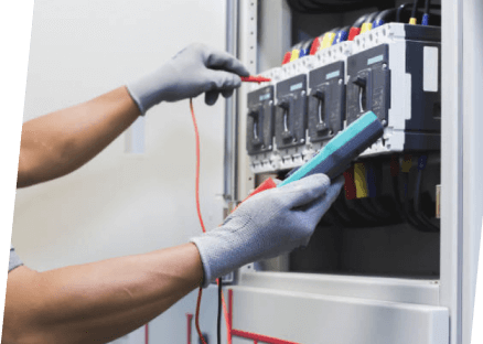 A technician in gloves focuses on a panel, showcasing the professional services of Paragon Service Pros.