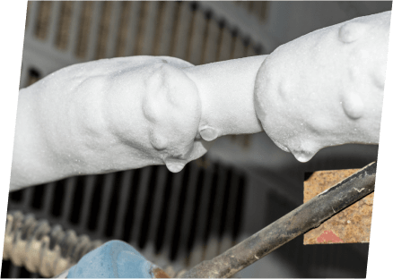 Detailed view of a pipe featuring a white substance, highlighting the expertise of Paragon Service Pros in plumbing services.