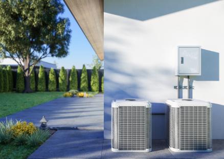 Two air conditioners installed outside a house, showcasing Paragon Service Pros' quality service and installation expertise.
